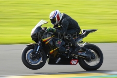 A bike pulling a wheelie at Anglesey Circuit