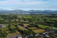 Caernarfon Castle and Snowdonia from Dwyran, Anglesey