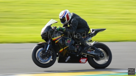 A bike pulling a wheelie at Anglesey Circuit