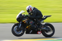 A bike pulling a wheelie at Anglesey Circuit